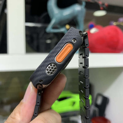 S8 Frosted Fiber Watches Bands showing a close-up of the watch case with carbon fiber texture and orange button.