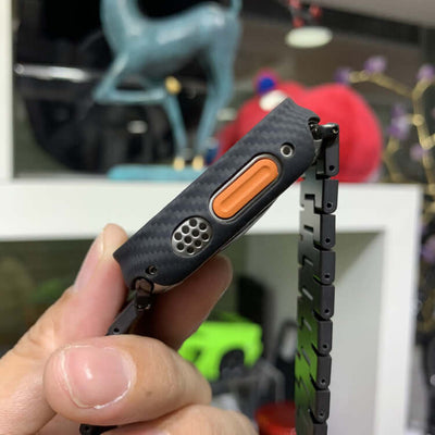 Close-up of S8 Frosted Fiber Watches Bands showing carbon fiber texture and orange button detail.