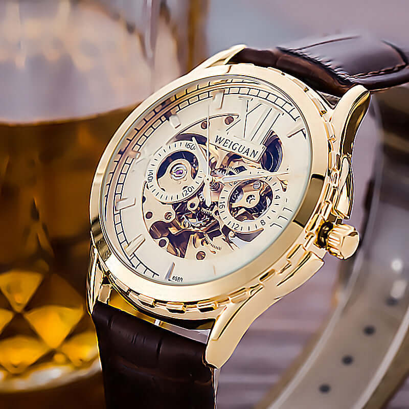 Men's Fashion Personality Hollow Luminous Waterproof watch with gold case and brown leather strap.