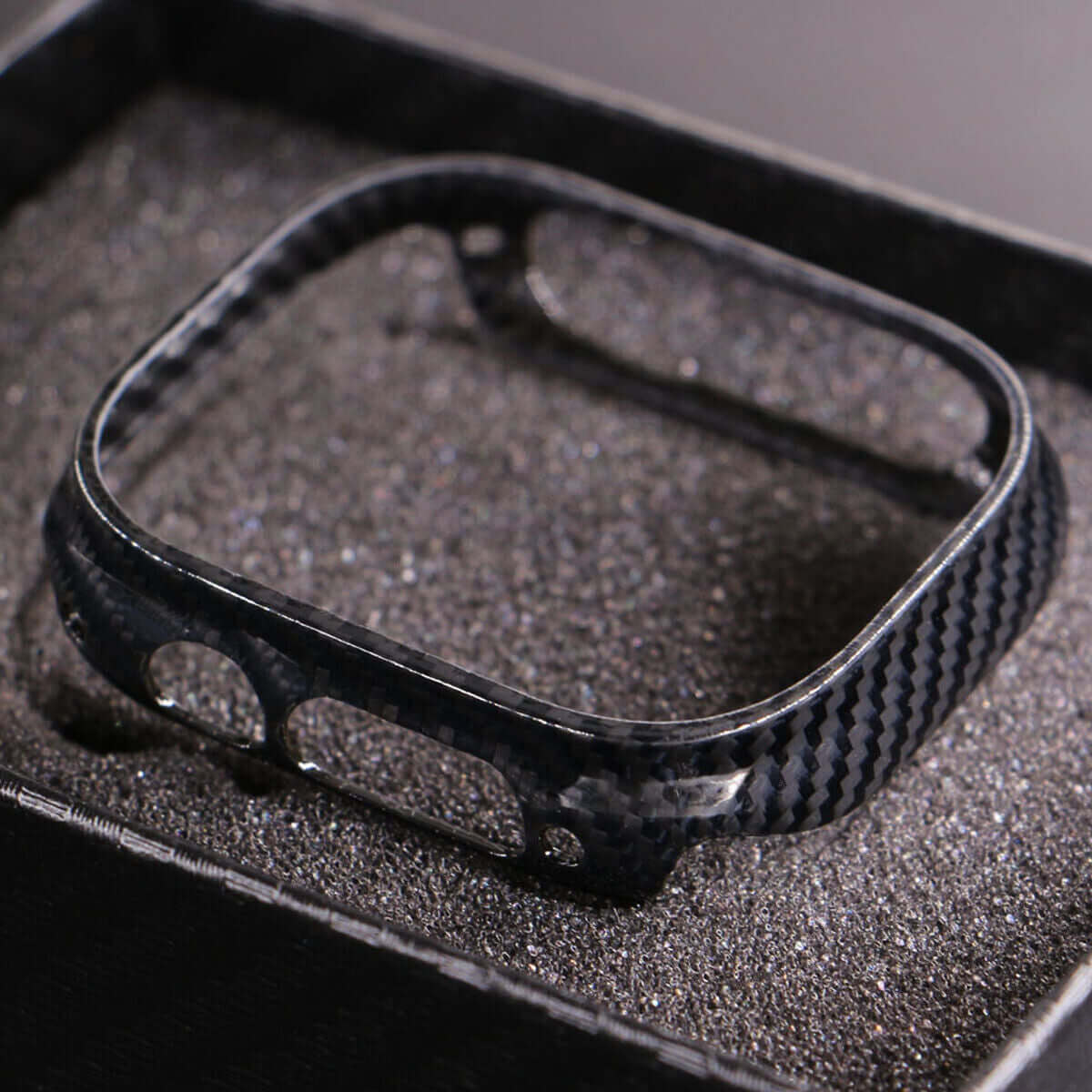 S8 Frosted Fiber Watches Bands showcased in a close-up image of a carbon fiber watch case with a bright black finish.